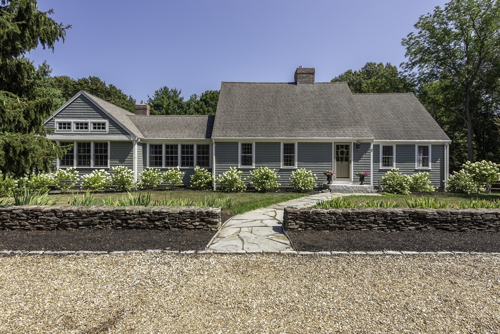 3 Jeffrey's Neck Road Ipswich, MA 01938 - Photo 8 of 42 a front view of a house with a garden