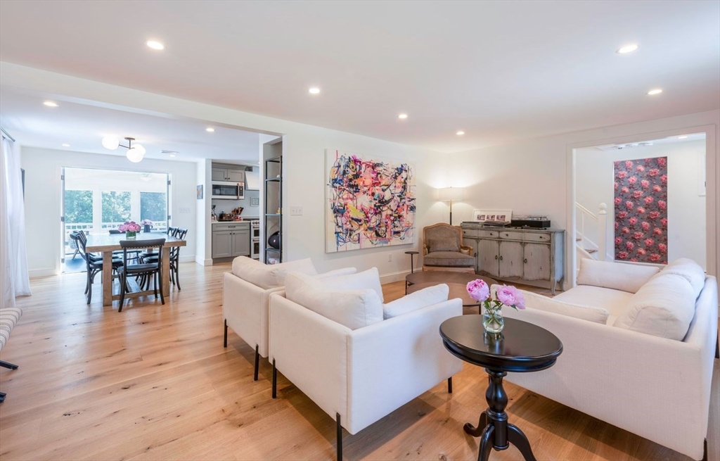 3 Jeffrey's Neck Road Ipswich, MA 01938 - Photo 9 of 42 a living room with furniture and a wooden floor