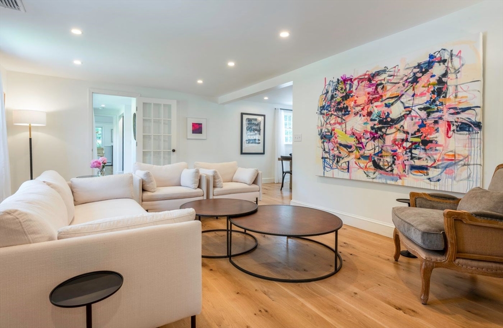3 Jeffrey's Neck Road Ipswich, MA 01938 - Photo 10 of 42 a living room with furniture and a painting on the wall