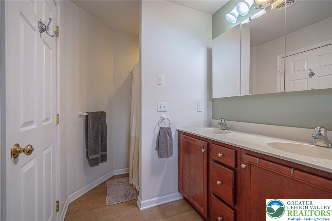 231 7th Avenue Bethlehem, PA 18018 - Photo 24 of 34 a bathroom with a sink and mirror
