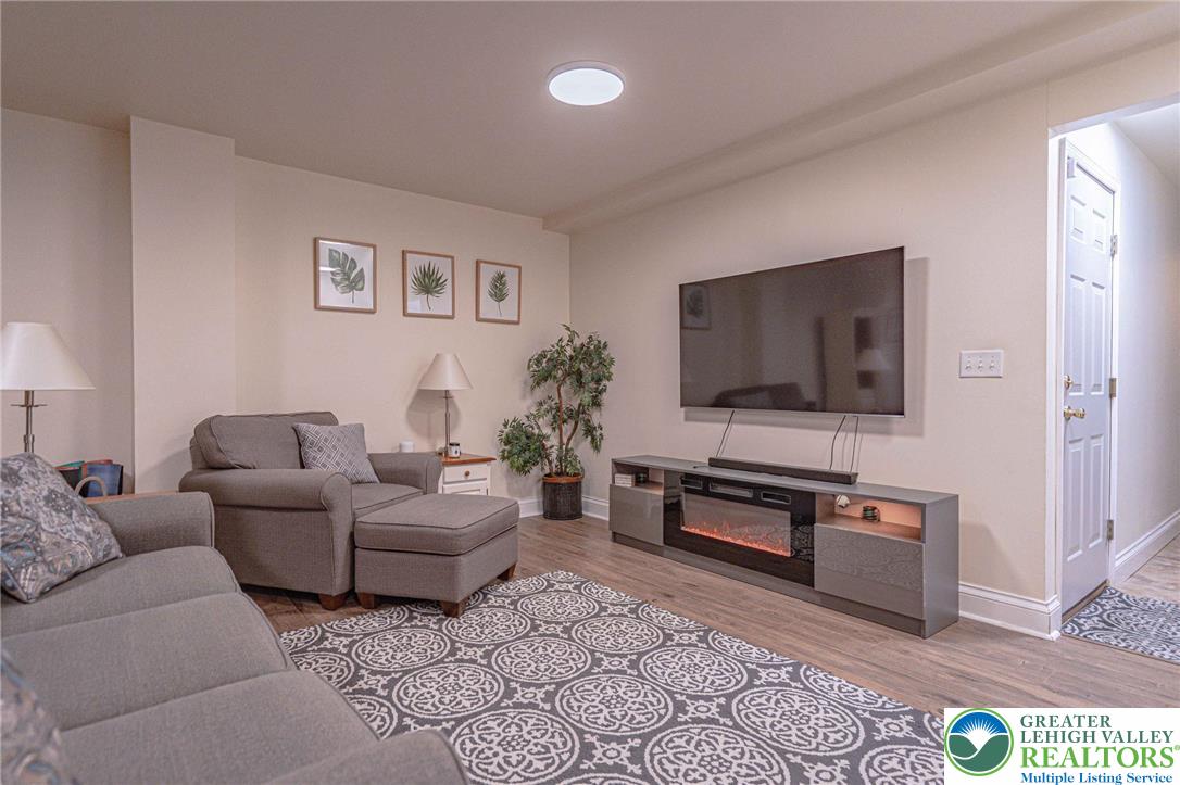 231 7th Avenue Bethlehem, PA 18018 - Photo 29 of 34 a living room with furniture and a flat screen tv