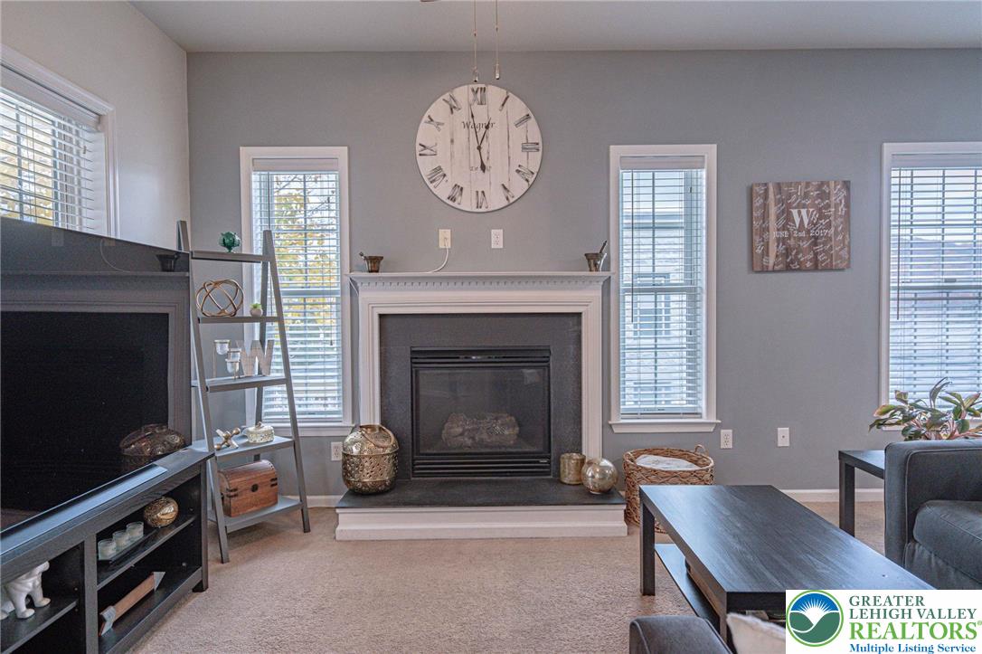231 7th Avenue Bethlehem, PA 18018 - Photo 5 of 34 a living room with furniture a flat screen tv and a fireplace