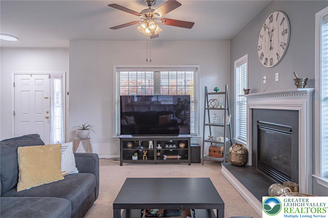 231 7th Avenue Bethlehem, PA 18018 - Photo 8 of 34 a living room with furniture a flat screen tv and a fireplace