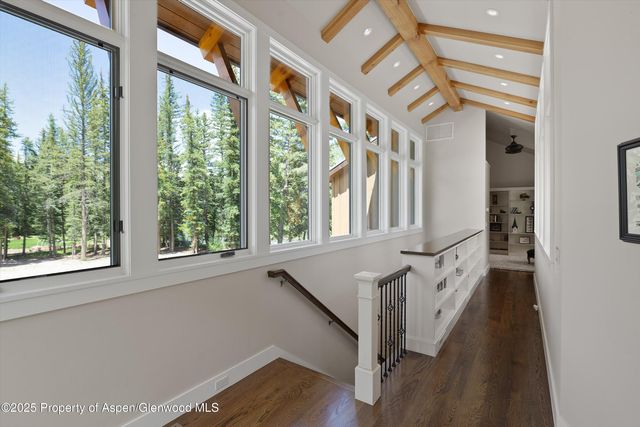 a view of an entryway with wooden floor