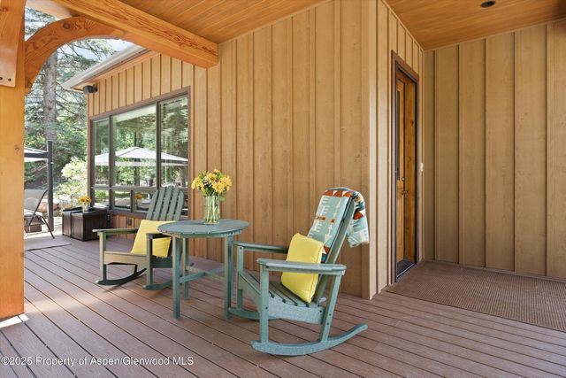 a living room filled with furniture and a window