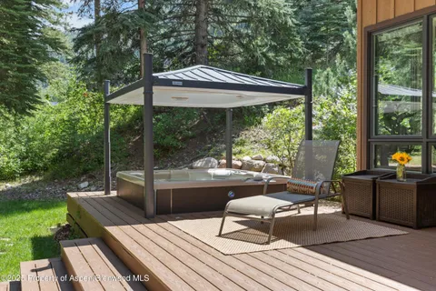 a view of a patio with a table chairs and a patio