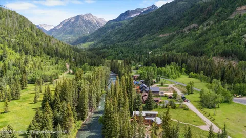a view of a town with mountains in the background