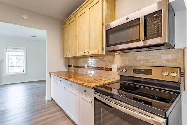 a kitchen with appliances and cabinets