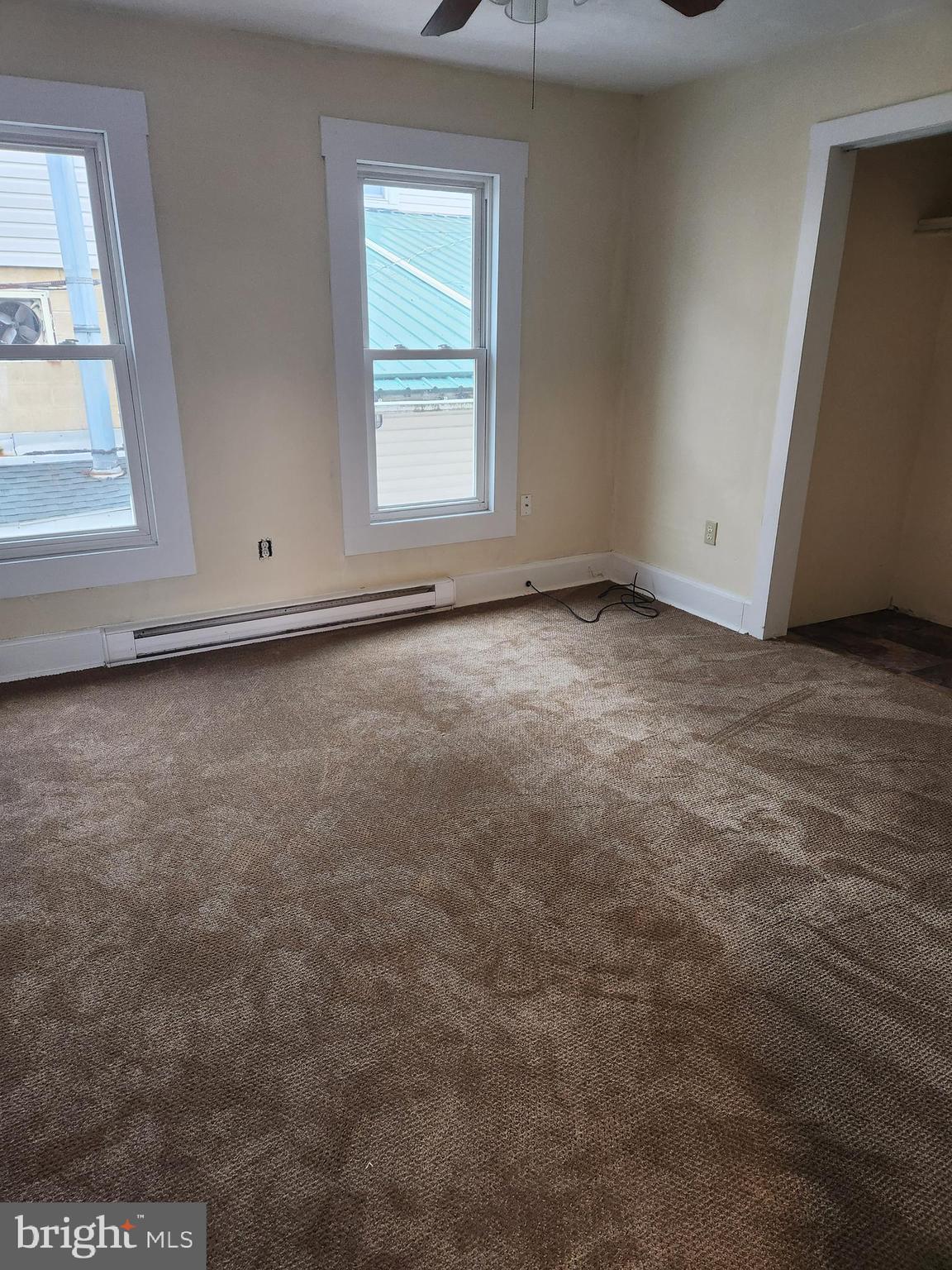 122 Spring Street, Unit B Keyser, WV 26726 - Photo 4 of 8 an empty room with a window