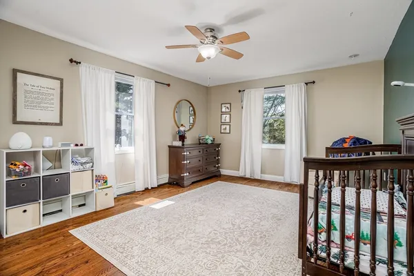 a bedroom with furniture and a window
