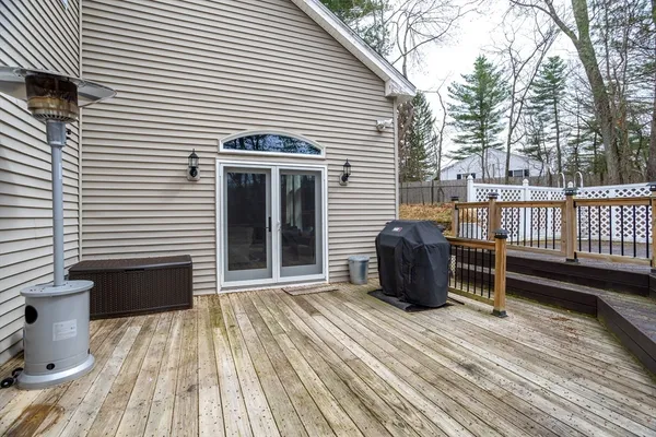 a view of a deck with table and chairs and wooden floor