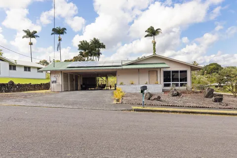 a view of a house with sitting area and furniture