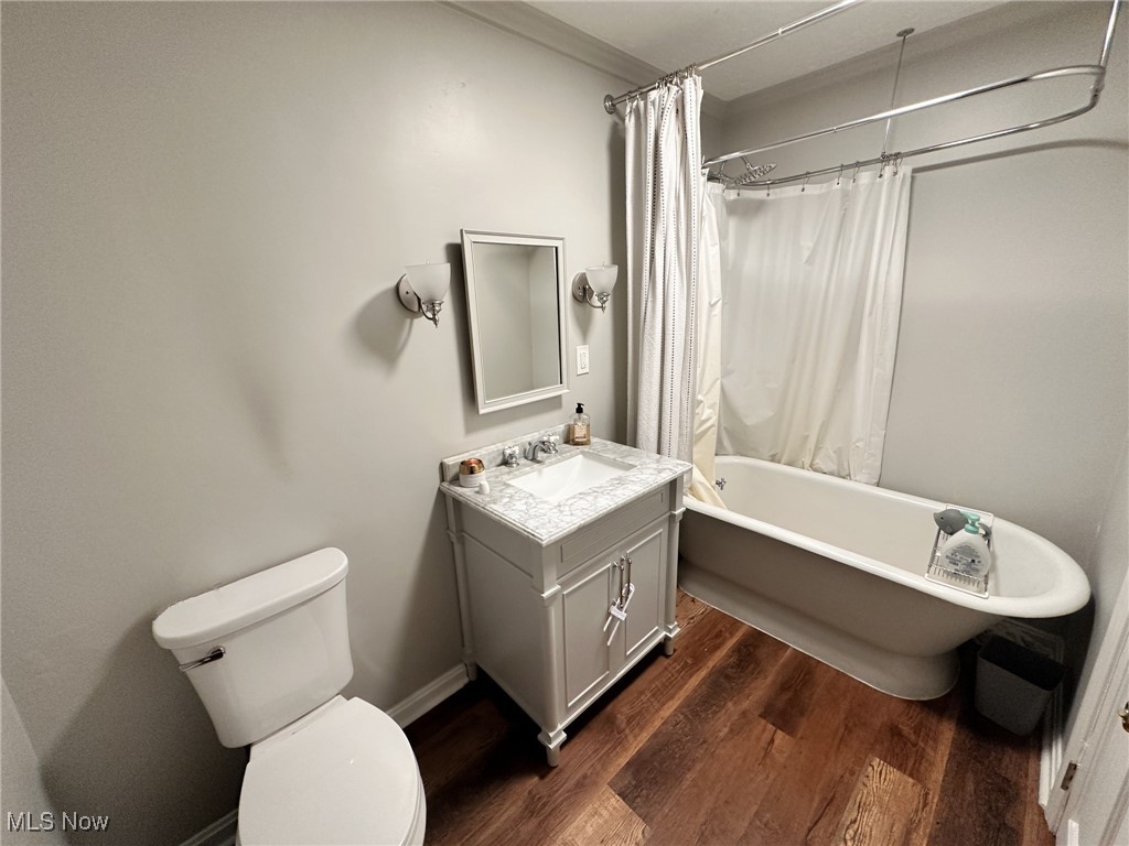 8145 Chagrin Road Chagrin Falls, OH 44023 - Photo 17 of 40 Bathroom with vanity, dark wood-style floors, and a combined bath / shower with freestanding tub