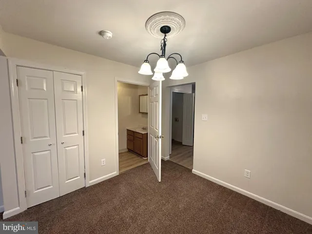a view of a chandelier and window in a room