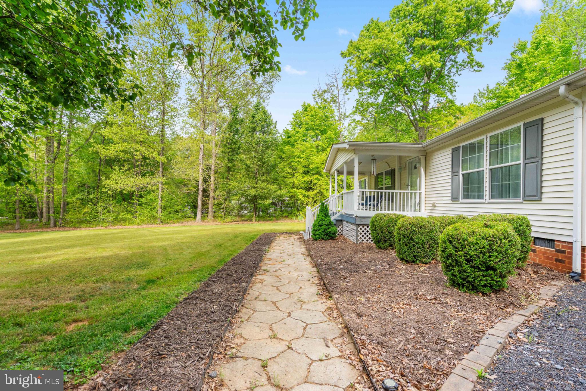 2319 Sizer Road Beaverdam, VA 23015 - Photo 12 of 61 a view of a house with yard and a garden