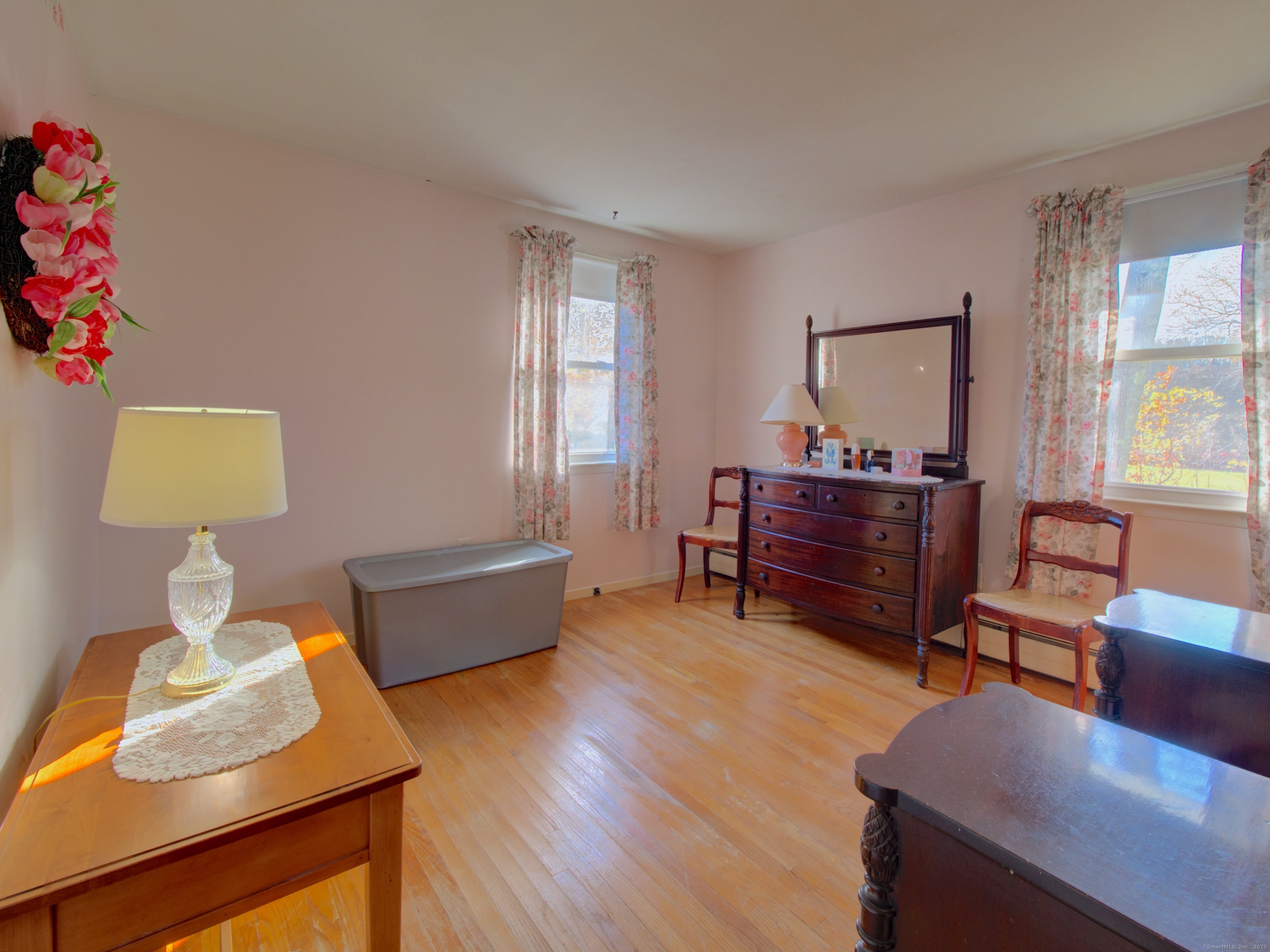 5 Sachem Lane Ledyard, CT 06339 - Photo 12 of 36 a living room with furniture and a wooden floor