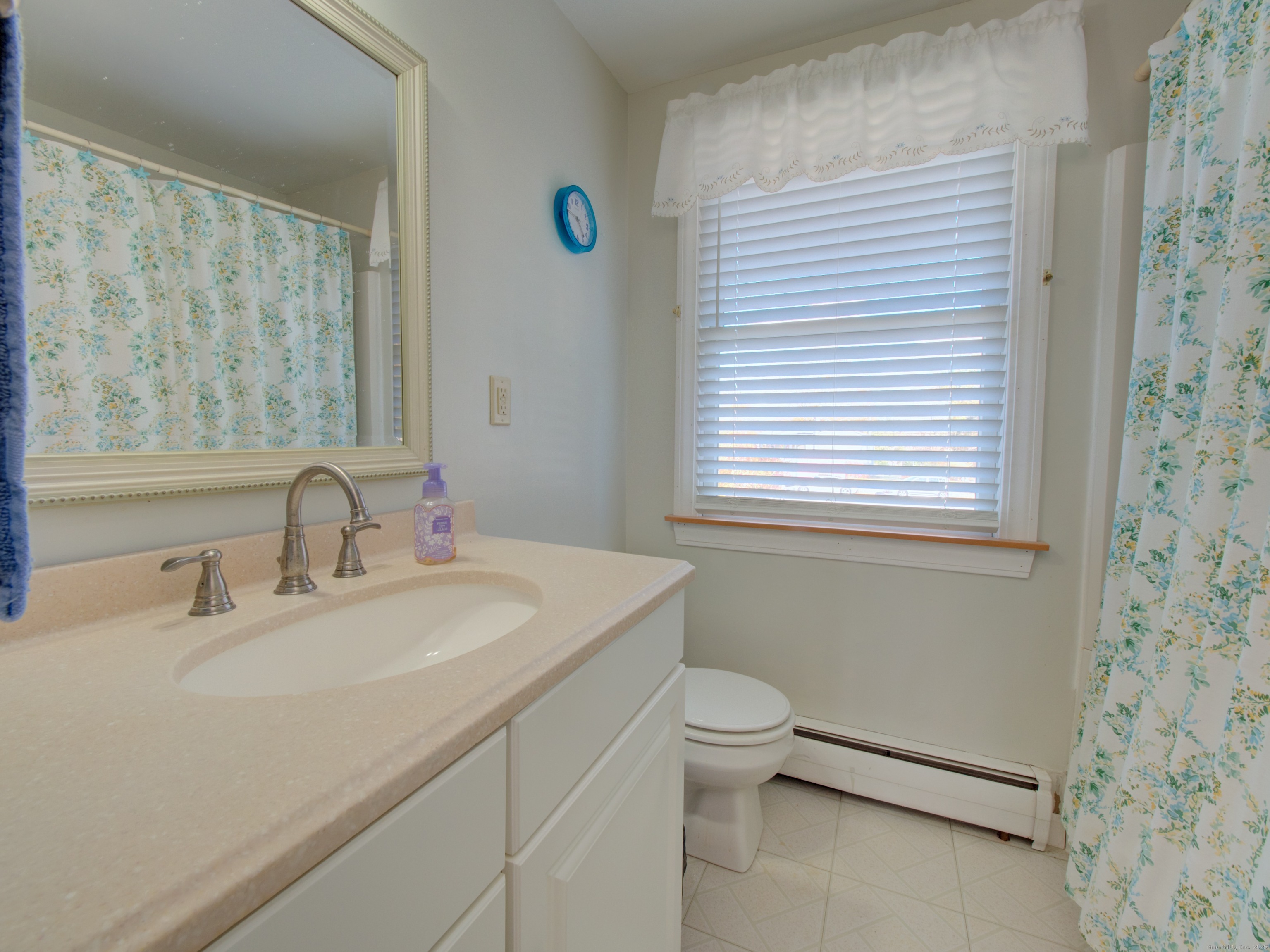 5 Sachem Lane Ledyard, CT 06339 - Photo 16 of 36 a bathroom with a sink toilet and a mirror