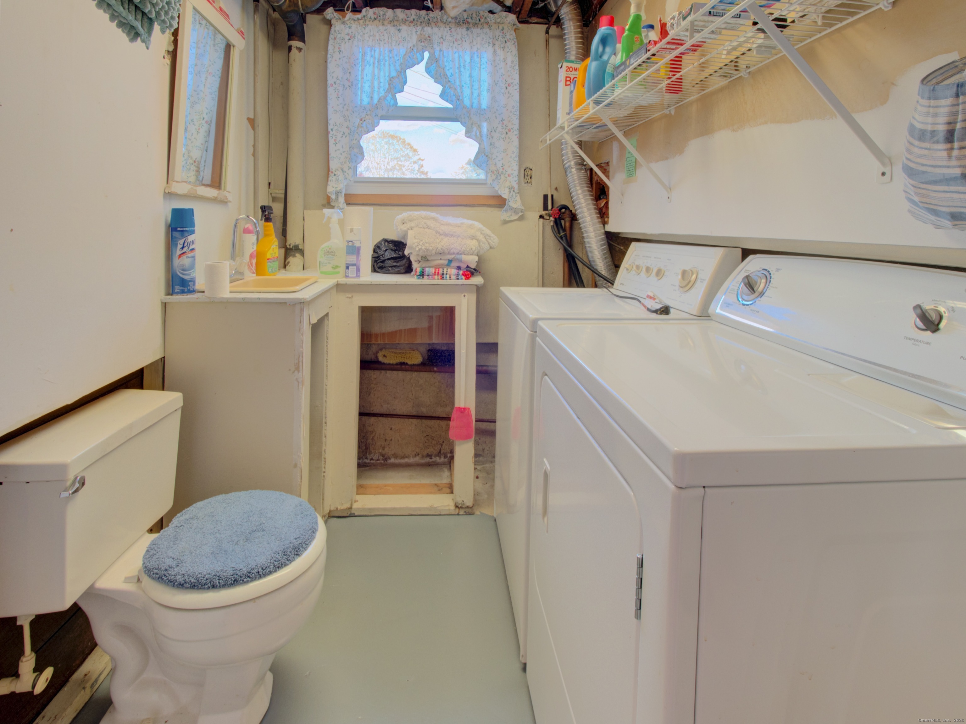 5 Sachem Lane Ledyard, CT 06339 - Photo 23 of 36 a bathroom with a sink a toilet and a mirror