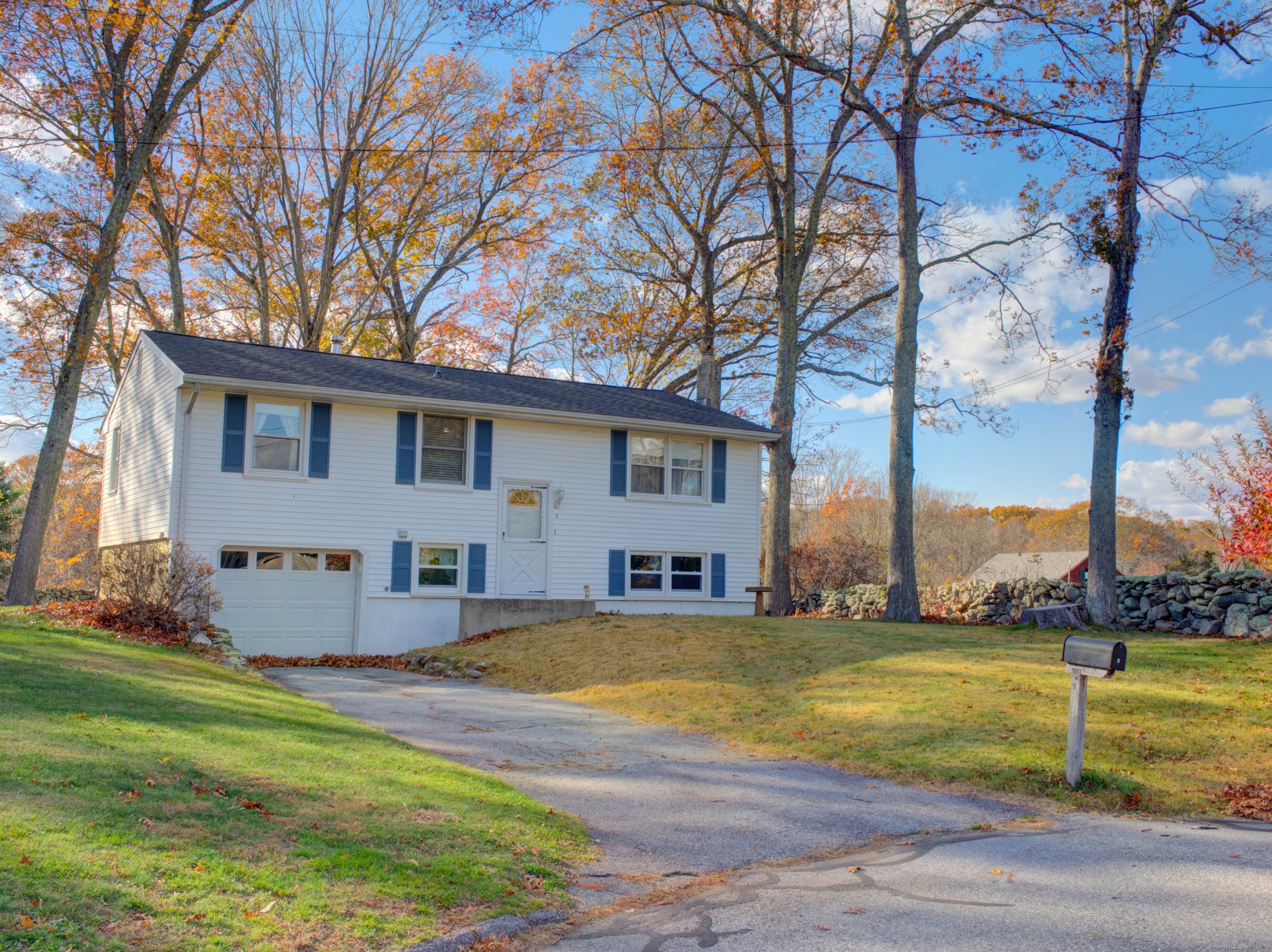5 Sachem Lane Ledyard, CT 06339 - Photo 24 of 36 a view of a house with a swimming pool