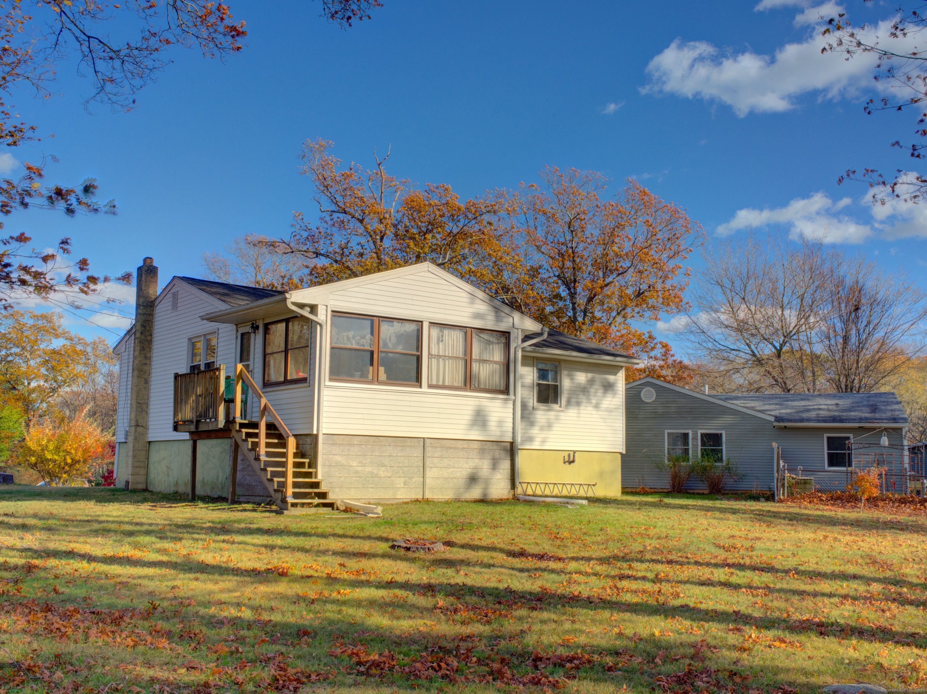5 Sachem Lane Ledyard, CT 06339 - Photo 31 of 36 a view of a big house with many windows