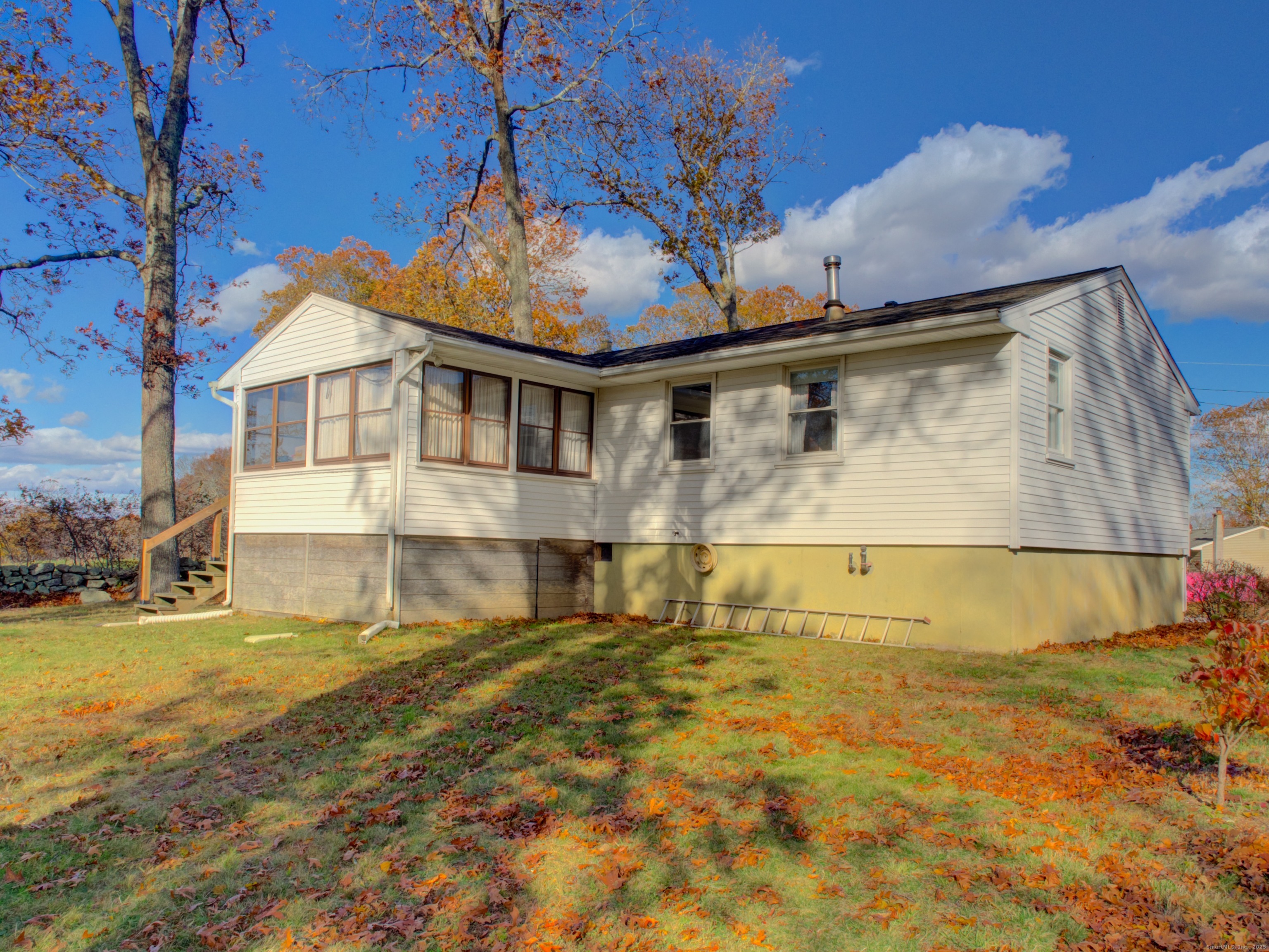 5 Sachem Lane Ledyard, CT 06339 - Photo 34 of 36 a view of a big yard next to a building