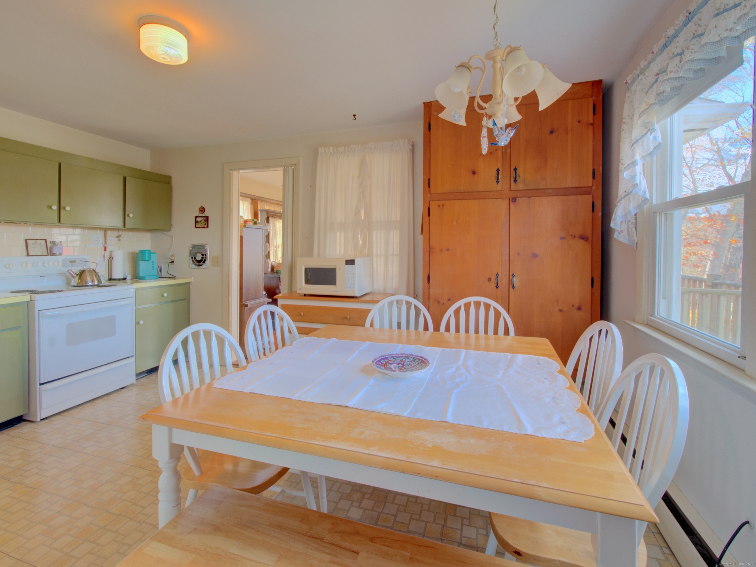 5 Sachem Lane Ledyard, CT 06339 - Photo 4 of 36 a dining room with furniture and wooden floor