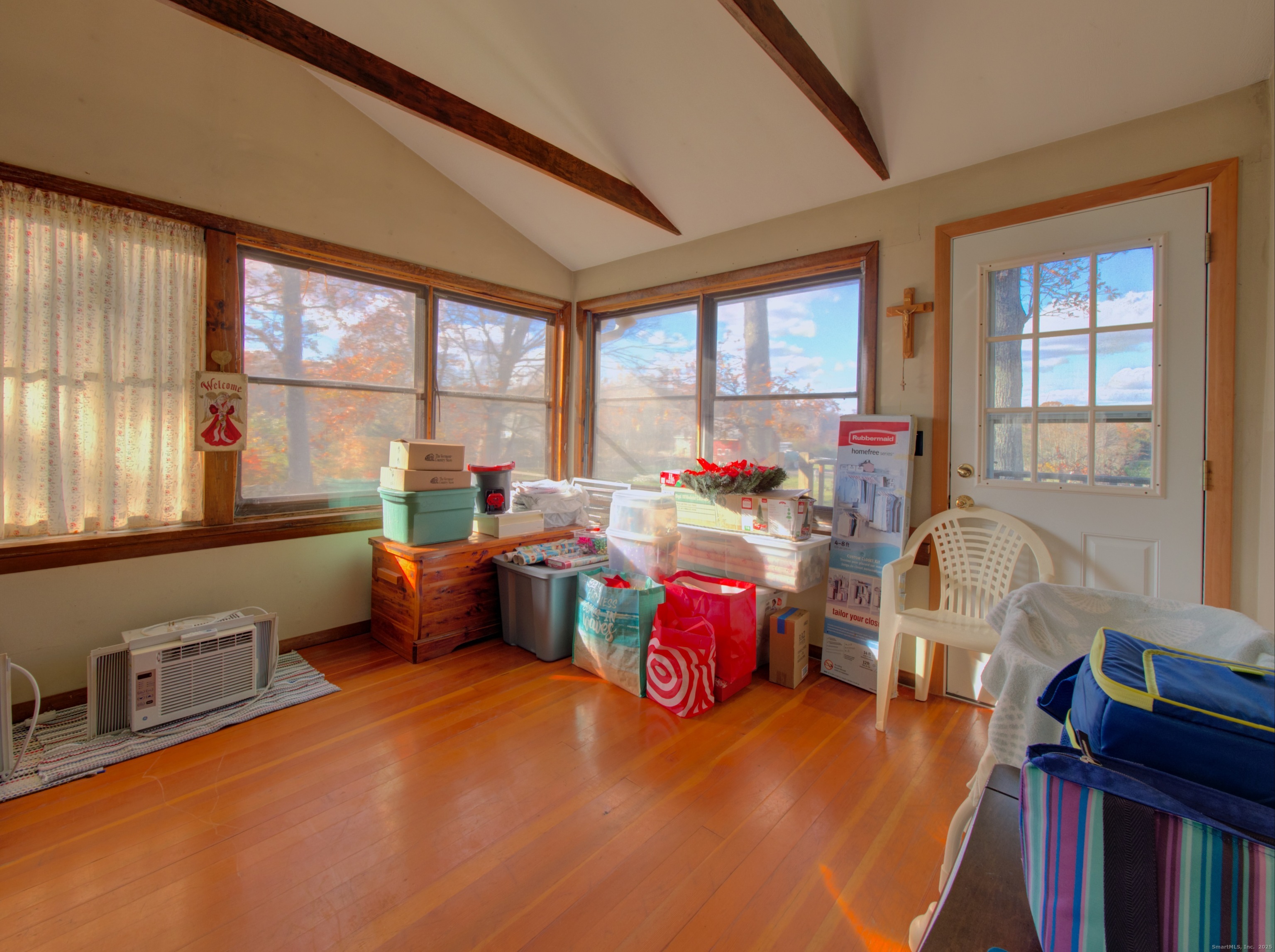 5 Sachem Lane Ledyard, CT 06339 - Photo 10 of 36 a bedroom with furniture and a large window