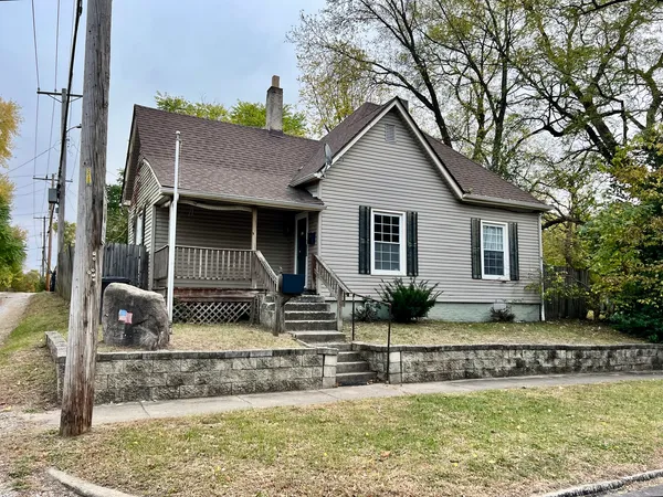 a view of a house with a yard and plants