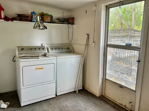 a utility room with dryer and washer