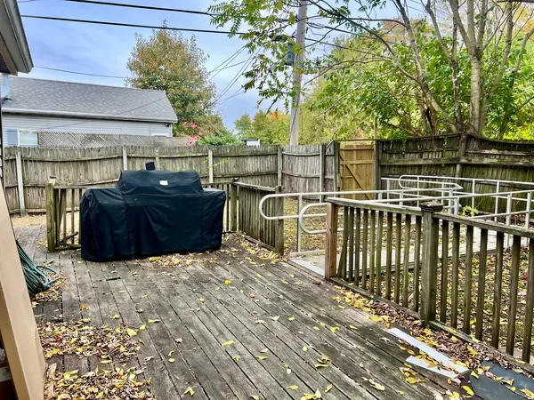 a view of an outdoor space with wooden deck