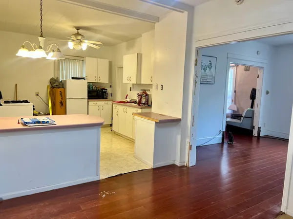 a view of a living room and kitchen view