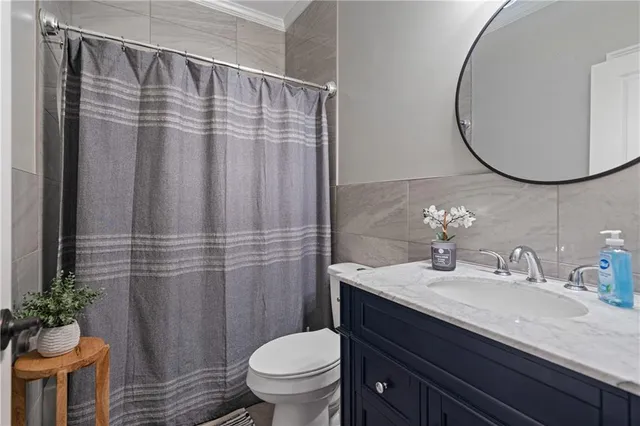 a view of a porch with furniture and a potted plant