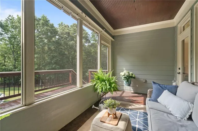 a view of a balcony with wooden floor