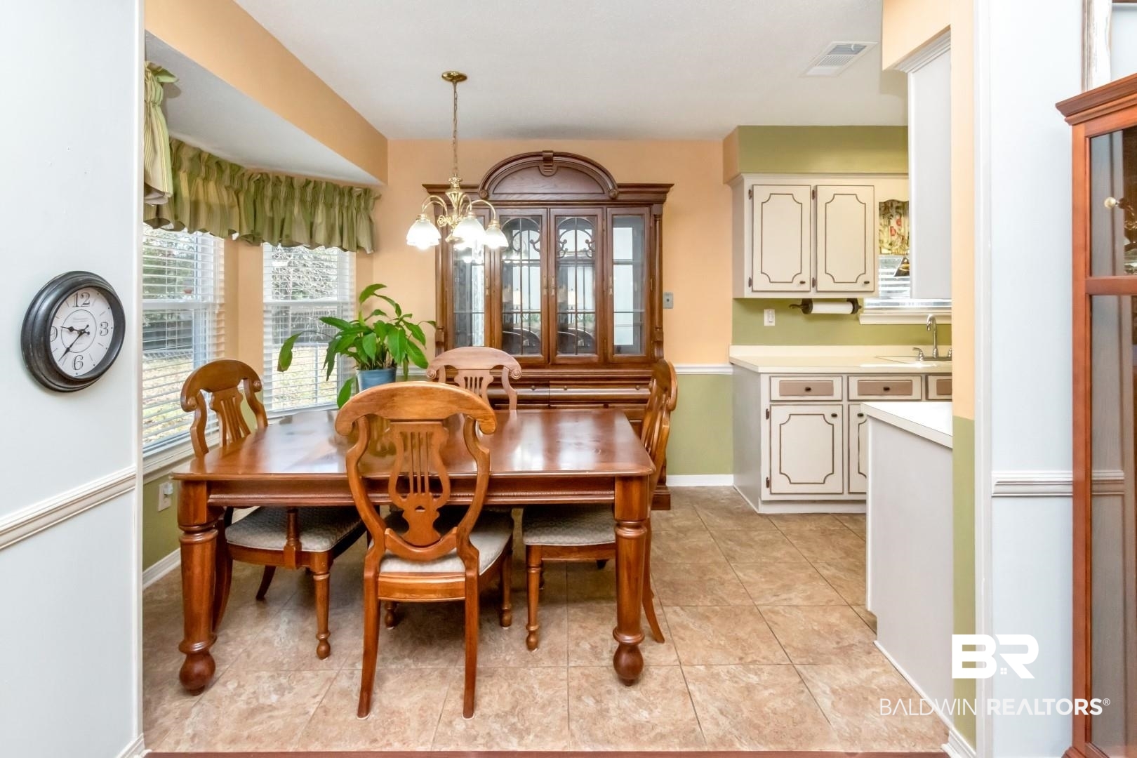 9360 Burnt Tree Drive Mobile, AL 36695 - Photo 8 of 28 Tiled dining space featuring sink and a chandelier