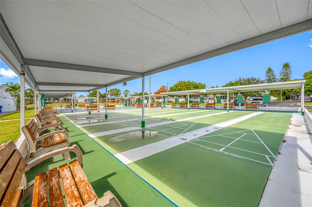 50 Liberty Way, Unit 10 Palm Harbor, FL 34684 - Photo 23 of 23 a view of a swimming pool with an outdoor seating