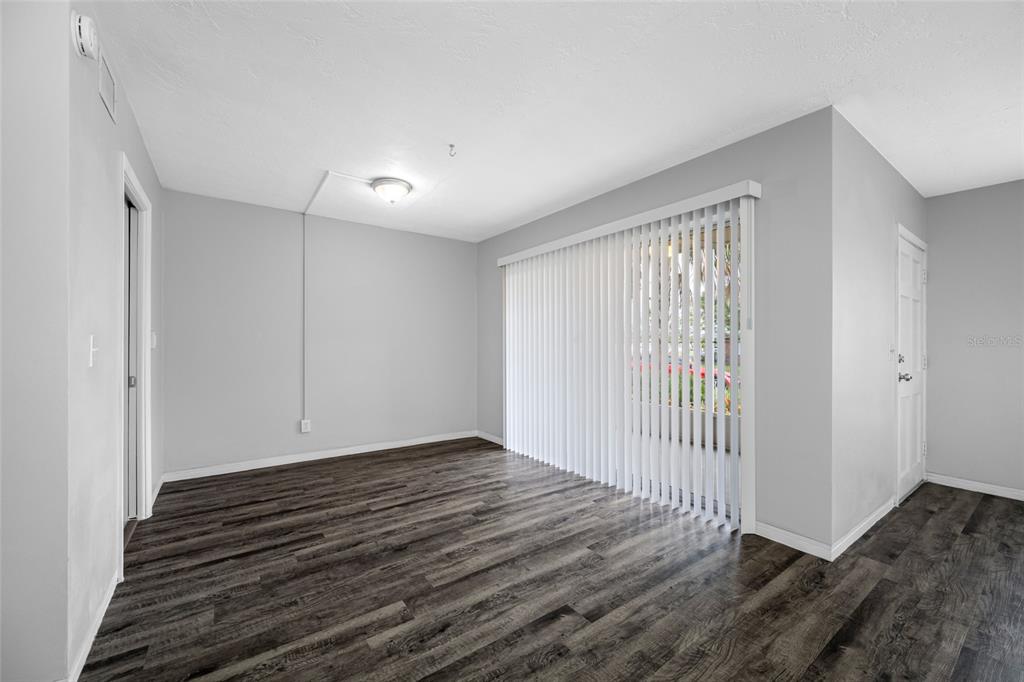 50 Liberty Way, Unit 10 Palm Harbor, FL 34684 - Photo 3 of 23 a view of a room with wooden floor and a window