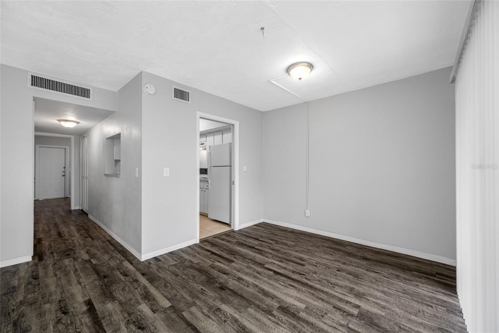 50 Liberty Way, Unit 10 Palm Harbor, FL 34684 - Photo 4 of 23 a view of hallway with wooden floor