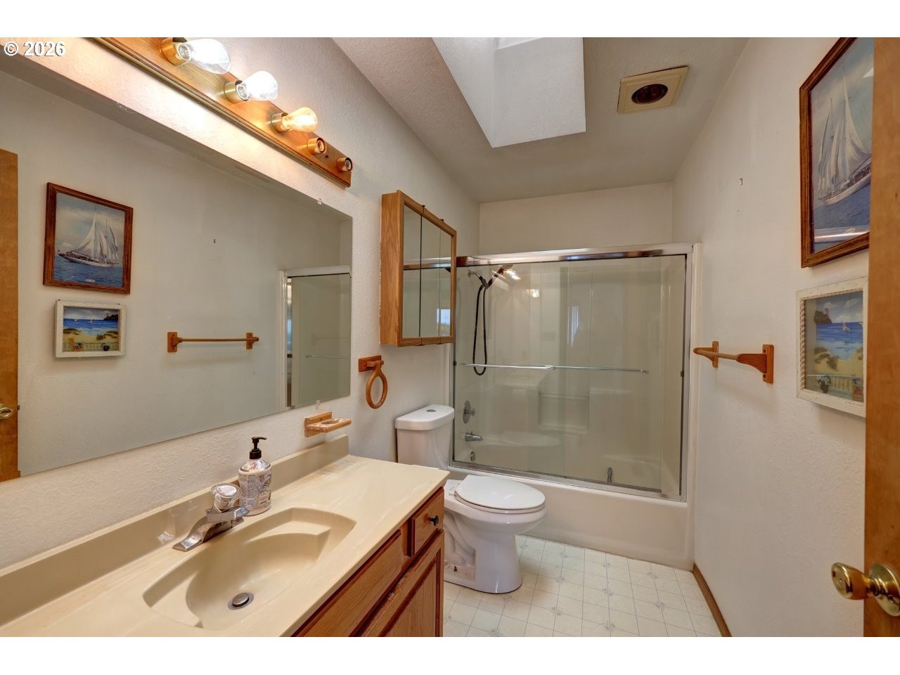 91828 Akerstedt Road Astoria, OR 97103 - Photo 12 of 48 a bathroom with a sink toilet a mirror and shower