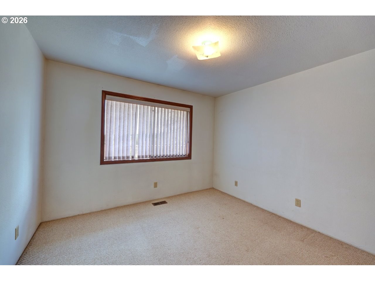 91828 Akerstedt Road Astoria, OR 97103 - Photo 14 of 48 a view of an empty room with a window