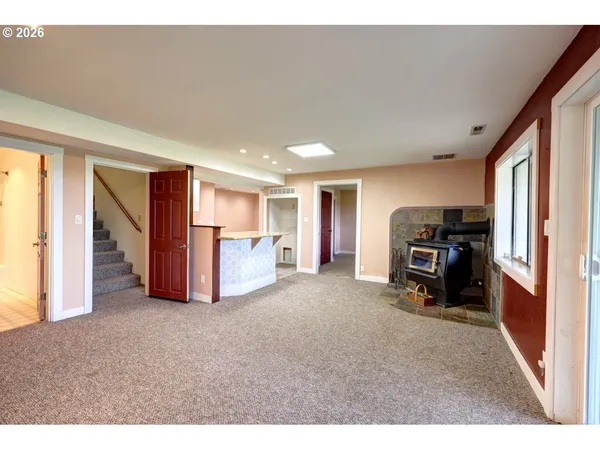 a kitchen with kitchen island granite countertop a sink and stove