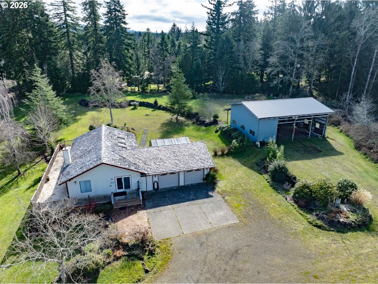 91828 Akerstedt Road Astoria, OR 97103 - Photo 3 of 48 an aerial view of a house with swimming pool and garden