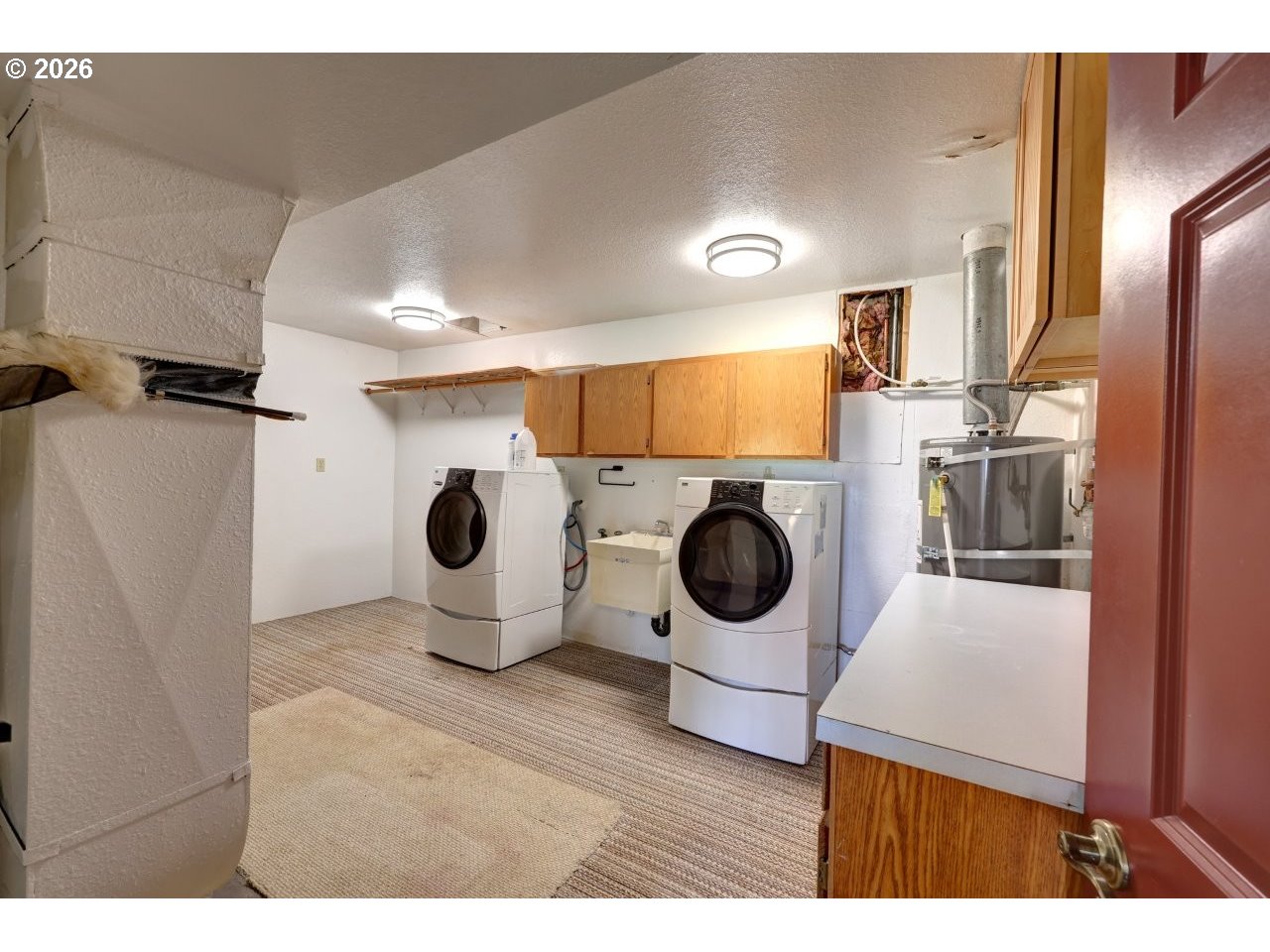 91828 Akerstedt Road Astoria, OR 97103 - Photo 34 of 48 a kitchen with a stove a refrigerator and a wooden floor