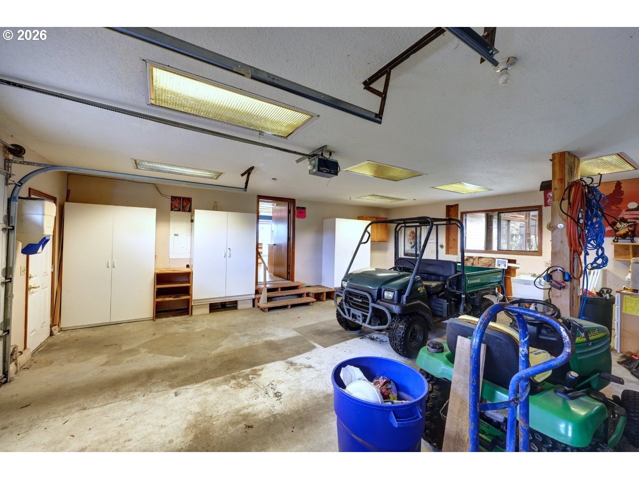 91828 Akerstedt Road Astoria, OR 97103 - Photo 36 of 48 a living room with furniture a window and gym equipment