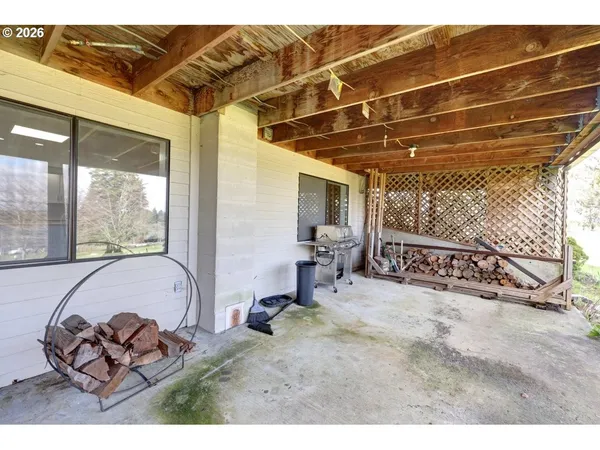 a view of backyard with small cabin