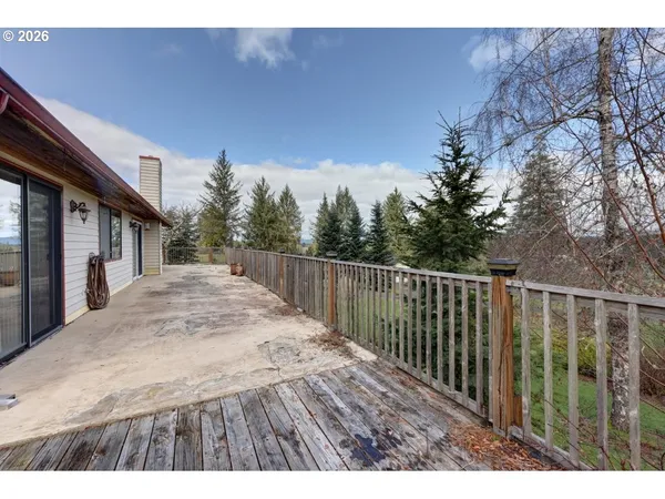 a view of a deck with a yard