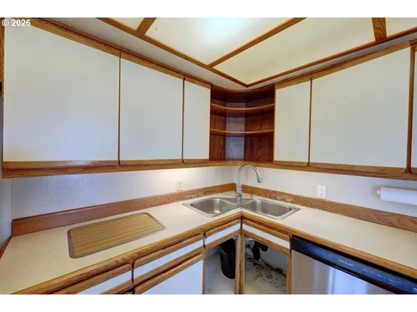a kitchen with a sink and a microwave