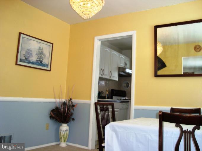 11423 Veirs Mill Road Silver Spring, MD 20902 - Photo 2 of 25 a bedroom with a bed and cabinets