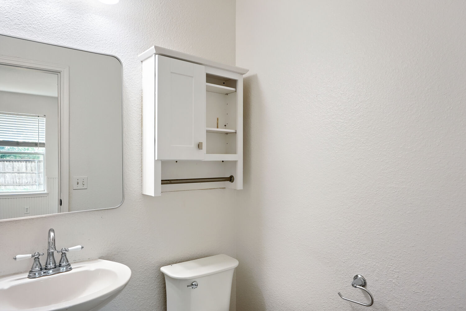 184 Unity Kyle, TX 78640 - Photo 10 of 11 a bathroom with a toilet a sink and mirror