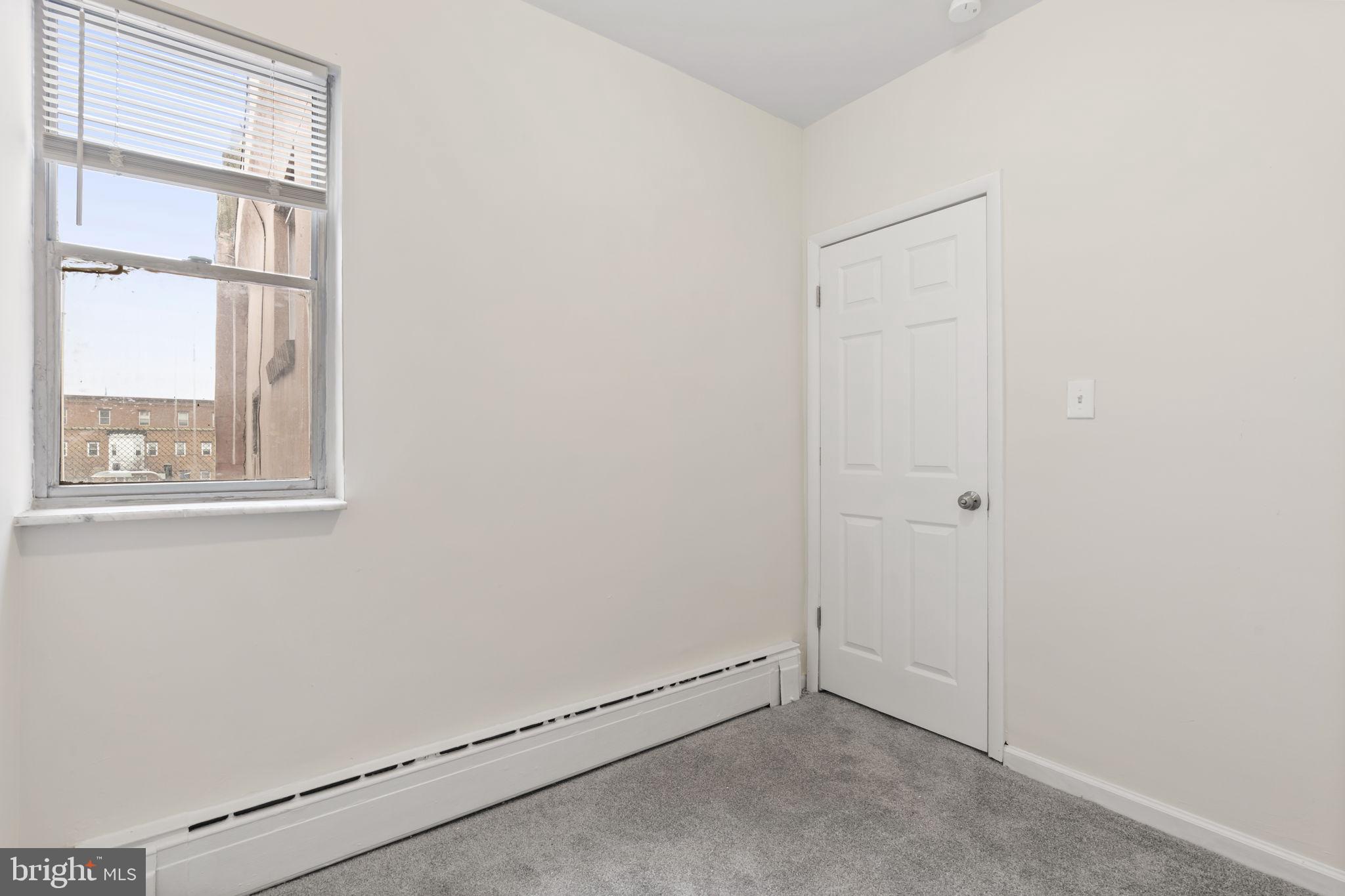 2246 South Hicks Street Philadelphia, PA 19145 - Photo 19 of 26 a view of an empty room with a window