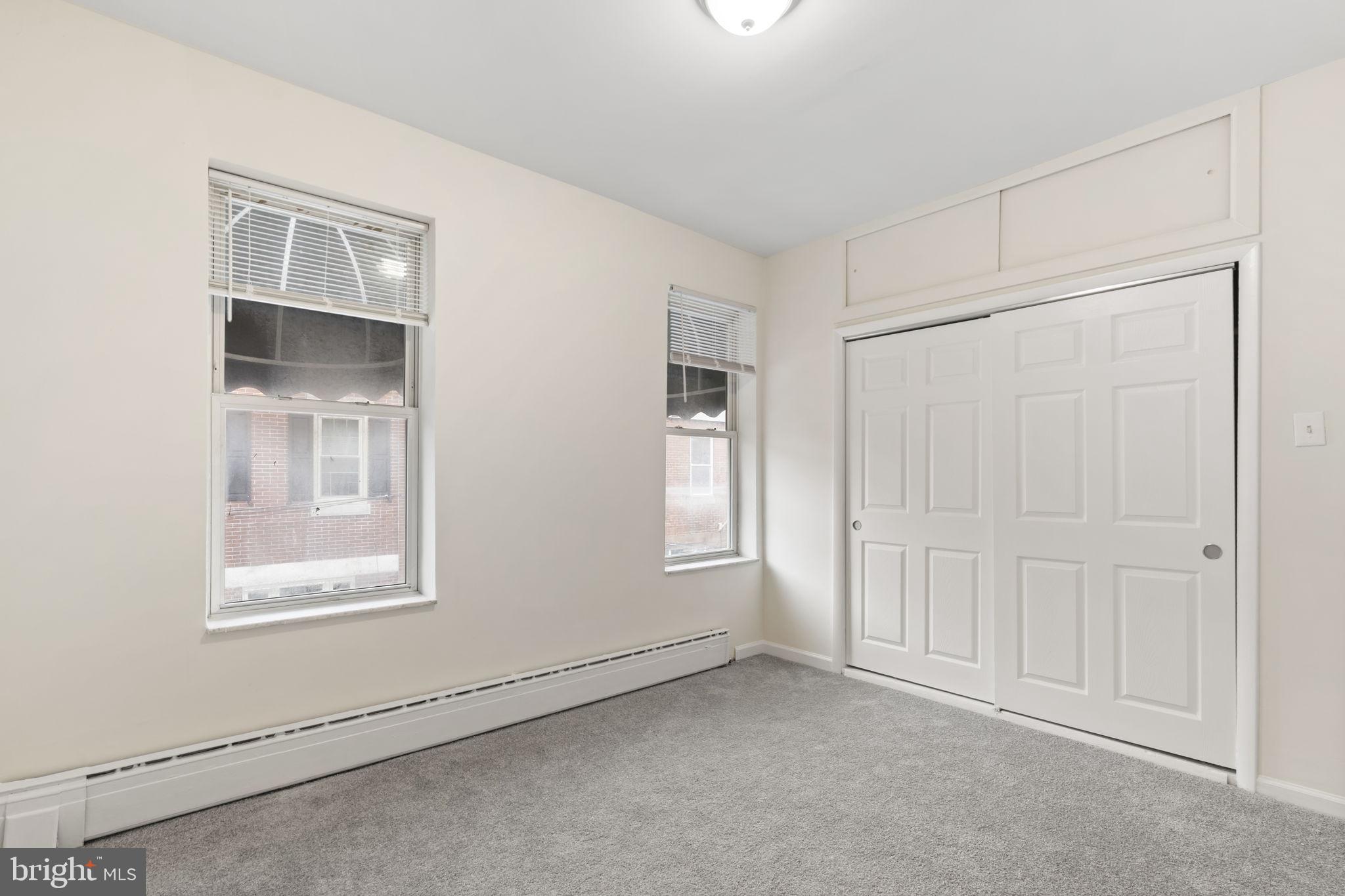 2246 South Hicks Street Philadelphia, PA 19145 - Photo 20 of 26 an empty room with windows and closet